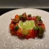 Carpaccio di salmone marinato alla barbabietola, panna cotta di bufala e olio aromatico al basilico.
