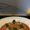 Risotto all'essenza di gamberi con olio all'nduja e crudo di gamberi marinati.