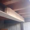 Rivestimento in abete di travi in ferro